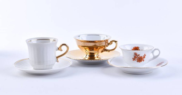A group of vitrine cups with saucers
