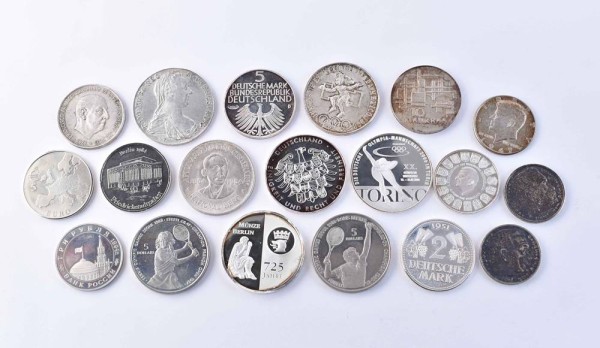 A group of coins and medals all over the world