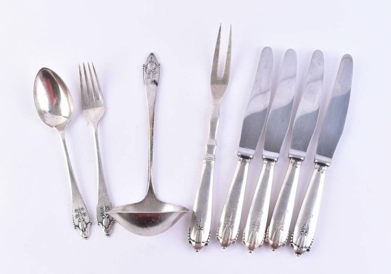A group of silver cutlery