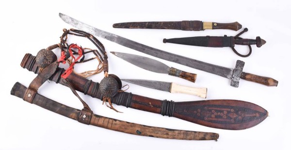 A group of daggers, 2 leather scabbards and 1 sword Africa