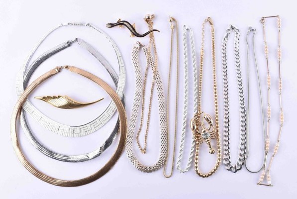 A group of silver necklaces