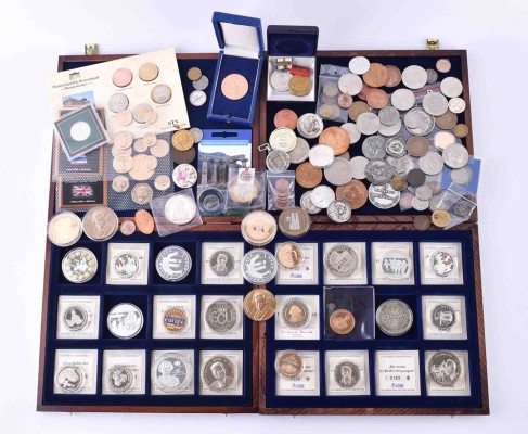A group of coins, medals and awards